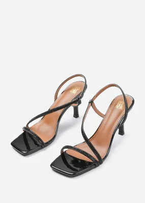 IVY CRYSTAL CROSS FOOT STRAP MID HEELS IN BLACK PATENT